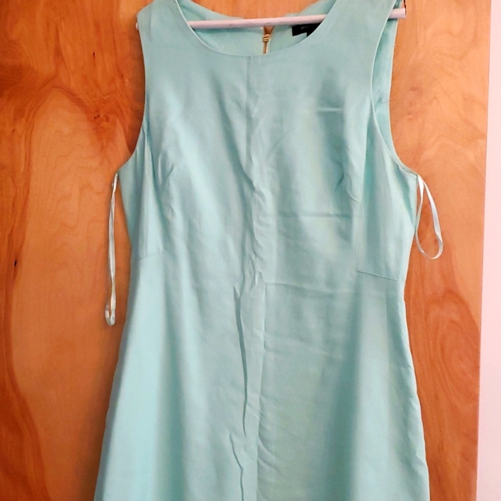 Mint green sleeveless dress. Worn once size 14, exposed zipper at the back